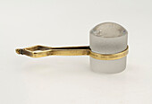 Stanhope magnifier with brass handle on white background