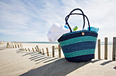 Beach bag with towels on beach,Nantucket Island