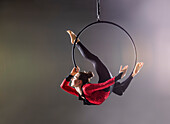 Teenage aerialist (14-15) performing aerial dance