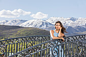 USA, Utah, Midway, Portrait of beautiful woman on footbridge in mountain scenery