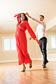 Couple dancing in empty apartment 
