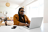 Woman working on laptop from home