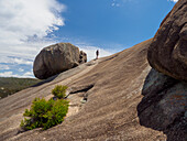 Australia, Queensland, Girraween National Park, Woman hiking on rock formation