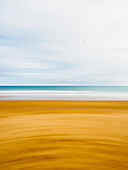 Australia, Queensland, Blurred image of sand beach and sea