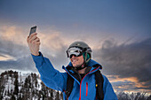 France, Haute Savoie, Chamonix, Mont Blanc, Skier taking selfie in mountains