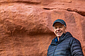 USA, Utah, Escalante, Portrait of senior man hiking in Grand Staircase-Escalante National Monument