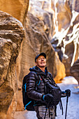 USA, Utah, Escalante, Man hiking in slot canyon in Grand Staircase-Escalante National Monument