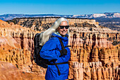 United States, Utah, Bryce Canyon National Park, Senior blonde woman hiking