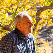 Senior man smiling and posing in Zion National Park