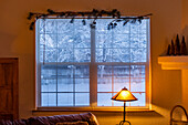 View from living room to snowy outdoors