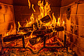 Close-up of fireplace burning wood