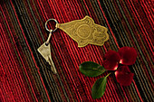 Brass room key and flower