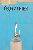 Water fountain and painting on wall