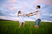 Couple dancing in agricultural field