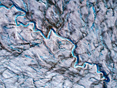 USA, Alaska, Tracy Arm-Fords Terror Wilderness, Overhead aerial view of meltwater streams and ponds on crevassed surface of Sawyer Glacier in Tracy Arm