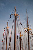 USA, Massachusetts, Cape Ann, Gloucester, America's Oldest Seaport, Gloucester Schooner Festival, schooner masts at dusk