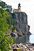 USA, Minnesota, North Shore, Lake Superior, Split Rock Lighthouse Station, View of Lighthouse from dock and boathouse landing