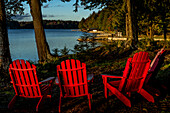 USA, New York, Adirondack State Park. Chairs on lake shore