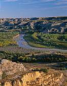 USA, North Dakota, Theodore Roosevelt National Park, Valley of the Little Missouri River with sedimentary hills rising in the distance, from River Bend Overlook, North Unit.