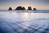 Sunset on Shi Shi Beach, sea stacks of Point of the Arches are in the distance. Olympic National Park, Washington State.
