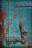 USA, Washington State, Port Townsend. Rusted metal door in fort