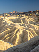 A view of Zabriskie Point at sunset, Amargosa Range, Death Valley National Park, California, United States of America, North America