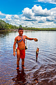 Pheasant fish caught by a Yanomami man, southern Venezuela, South America