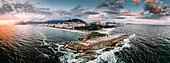 Aerial drone panorama of Ipanema and Copacabana beaches at sunset with Arpoador Rock closest to foreground and Sugarloaf Mountain visible, Rio de Janeiro, Brazil, South America
