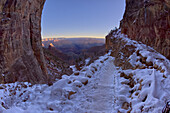 A winter sunrise view of Grand Canyon Arizona from Bright Angel Trail on the South Rim just past the second tunnel, Grand Canyon National Park, UNESCO World Heritage Site, Arizona, United States of America, North America