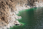 Salt scales out of the emerald water of the Dead Sea, Jordan, Middle East