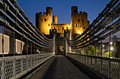 Thomas Telford's Conwy Suspension Bridge and Conwy Castle, UNESCO World Heritage Site, at night, Conwy, North Wales, United Kingdom, Europe