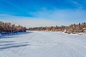 The frozen Assiniboine River in Winnipeg, Manitoba, Canada, North America