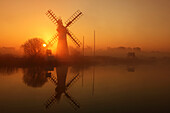 Winter sunrise over Thurne Mill, Norfolk Broads, Norfolk, England, United Kingdom, Europe
