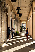 Sunlight streams through a colonnade, Cienfuegos, Cuba, West Indies, Caribbean, Central America