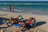 Lounging in the sun, Playas del Este, near Havana, Cuba, West Indies, Caribbean, Central America