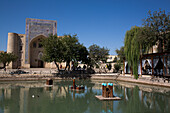 Lyabi Khauz Lake, Nodir Devonbegi Tekke in the background, Bukhara, Uzbekistan, Central Asia, Asia