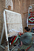Woman Weaving, Kilim Weaving Workshop, Ichon Qala (Itchan Kala), UNESCO World Heritage Site, Khiva, Uzbekistan, Central Asia, Asia