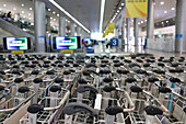 Baggage trolleys in arrivals area, International Airport, Ho Chi Minh City, Vietnam, Indochina, Southeast Asia, Asia