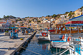 View of boats in harbour in Symi Town, Symi Island, Dodecanese, Greek Islands, Greece, Europe