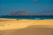 View of beach, Lobos Island and the Atlantic Ocean on a sunny day, Corralejo Natural Park, Fuerteventura, Canary Islands, Spain, Atlantic, Europe