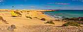 View of beach, surfers and the Atlantic Ocean on a sunny day, Corralejo Natural Park, Fuerteventura, Canary Islands, Spain, Atlantic, Europe