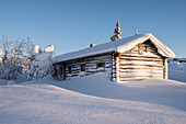 Typical wood chalet inside Pallas-Yllastunturi National Park, Muonio, Lapland, Finland, Europe