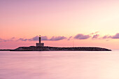view of the Vieste lighthouse, during a warm summer sunrise, municipality of Vieste, Foggia province, Apulia district, Italy, Europe