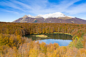 an aerial drone view of the lake area of Cerreto Laghi, with Lake Pranda in the foreground and Mount Belfiore in the background, during the autumn foliage, Tuscan-Emilian apennine national park, municipality of Ventasso, Reggio Emilia province, Emilia Romagna district, Italy, Europe