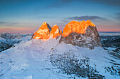 aerial view taken by drone of Sassolungo Group during a winter sunrise, near to Sella Pass, Gardena Valley, Dolomiti, Unesco World Heritage Site, Bolzano province, Trentino Alto Adige District, Italy, Europe