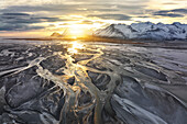 Aerial view taken by drone of Vestrahorn mountain, during a warm winter sunset, Austurland, Southern Iceland, Europe