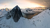 Aerial view taken from the drone of iconic Segla mountain during a winter sunset, Senja, Norway, Europe