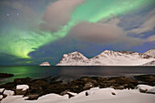 the magic of the arctic skies with the Northern Lights at Haukland beach, Lofoten island, Norway, Europe