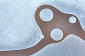 Bubbles in a iced puddle at Veneto, Italy