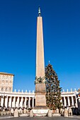 Obelisk on saint peter's square in rome with the pope's apartments in the background, vatican, rome, italy